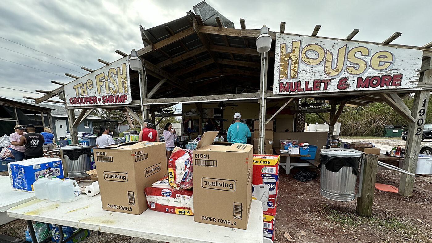 The open-air Fish House stand with its Grouper, Shrimp, Mullet & More sign